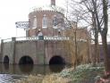 Back of Cruquiusmuseum, showing the beams of the pumping engine and the 9 meter drop in water level from the Spaarne river
